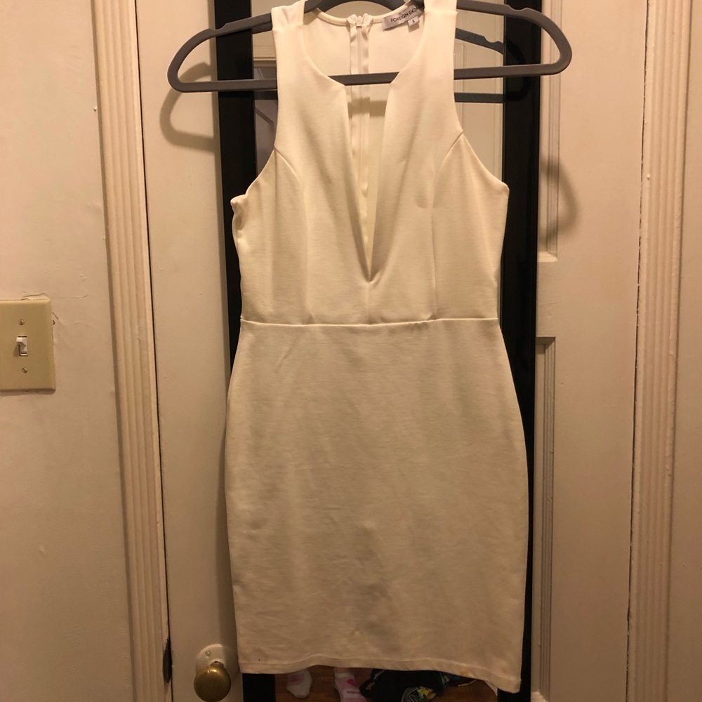 Tight white mini dress with deep neck small